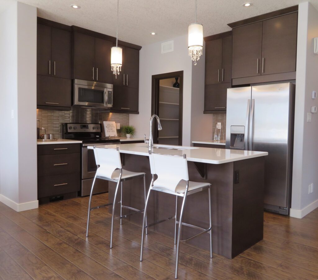 Globe pendant lights hanging over a kitchen island